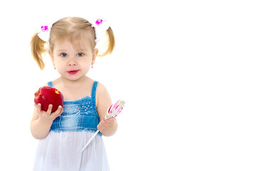Little girl with apple. Isolated on white background.