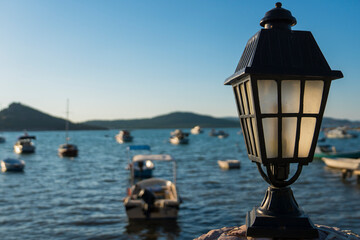 Old outdoor lamp sea view blurred background
