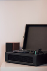 vinyl player on a white background, retro style in a modern interior