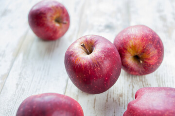 red apples on wooden table