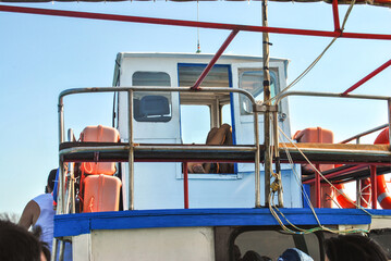 Captains cabin on old fish boat and orange lifebuoy