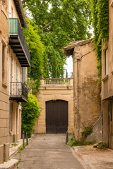 Fototapeta na wymiar Avignon, typical street, with colorful buildings 
