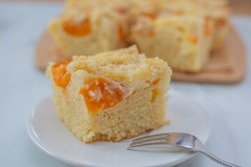 home made german apricot streusel cake on a table