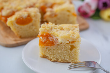 home made german apricot streusel cake on a table