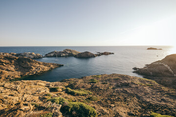 A rocky beach next to a body of water