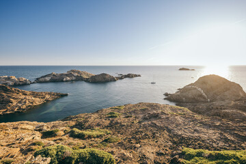 A rocky shore next to a body of water