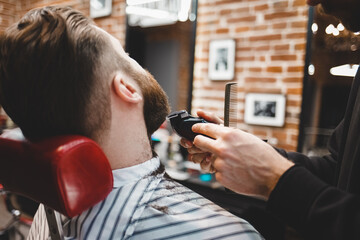 Barber cuts beard to a brutal guy