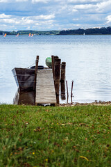 Boat standing on the pier, Lake Chiemsee, Bavaria, Germany