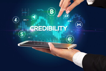 Close-up of a touchscreen with CREDIBILITY inscription, business opportunity concept
