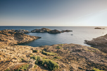 A rocky beach next to a body of water