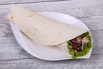 Tortilla with tuna, salad and dried tomato