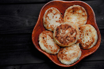 Cheesecakes in a bowl on a wooden background