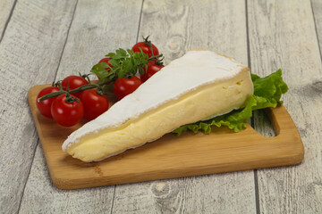 Fototapeta na wymiar Brie cheese triangle served salad