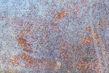 
Multi-colored, rusty surface of a metal plane. Theme Texture