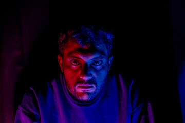 Muslim man with lights reflection on his face