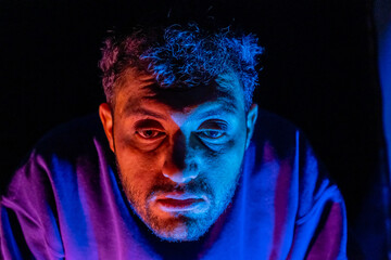 Muslim man with lights reflection on his face