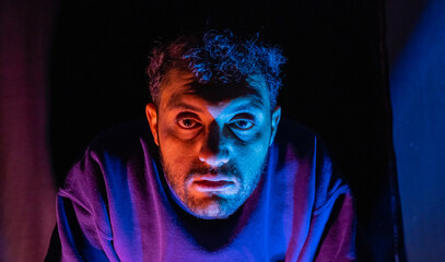 Muslim man with lights reflection on his face