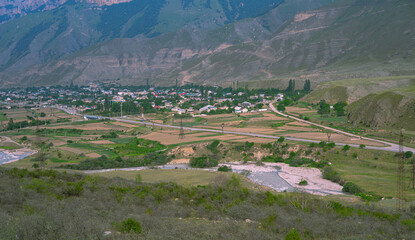 Fototapeta na wymiar Village with many houses in the mountains