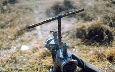 Leaky hydrant with attached hose