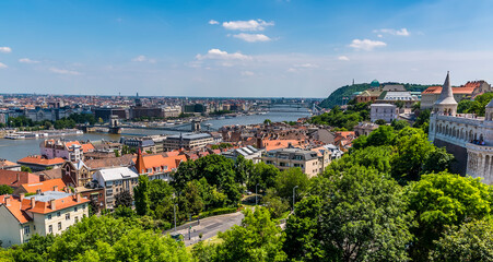 Fototapeta na wymiar The view from the Fisherman's Bastion towards the Chain Bridge eastward along the River Danube in Budapest in the summertime