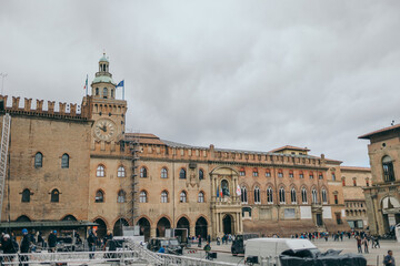 A group of people walking in front of a building
