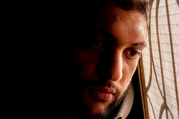 Arabic muslim man head leaning on window