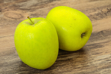 Two ripe green sweet apples