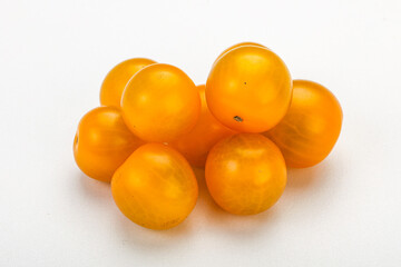 Fresh yellow cherry tomato heap