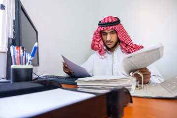 Arabic muslim employee completing the task in his hand