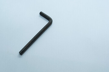An L key on a plain white background. Selective focus, Selective focus on subject, background blur