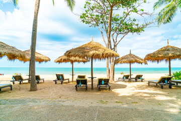 beach chair and umbrella with sea beach background