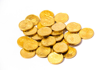 Golden Euros, cents, coins, spread around like a treasure. Seen from above on an angular look.