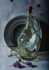 Vintage Still Life With A Glass Bottle And Aluminum Plate 