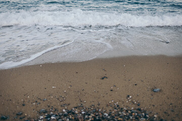 A sandy beach next to the ocean