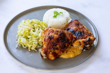 Crispy chicken thighs, peanut sauce, rica nad pickled lettuce