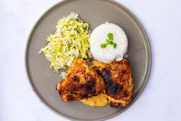 Crispy chicken thighs, peanut sauce, rica nad pickled lettuce