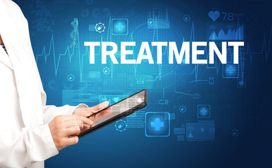 young doctor writing down notes with TREATMENT inscription, healthcare concept