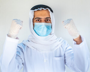 Fototapeta na wymiar Arabic muslim doctor wearing mask with hygiene products