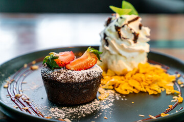 chocolate cake lava with strawberry and vanilla ice-cream