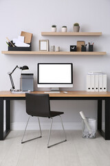 Modern computer on table in office interior. Stylish workplace