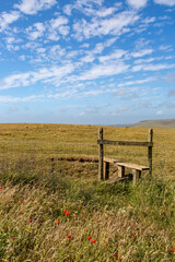 A stile in the Sussex countryside, on a sunny summers day