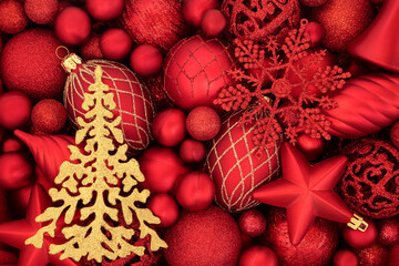 Gold sparkling Christmas tree & red bauble background. Abstract composition for the xmas festive season. Flat lay, top view.