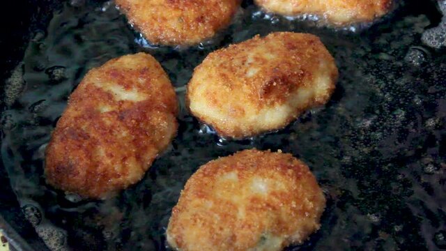 Golden cutlets in a pan