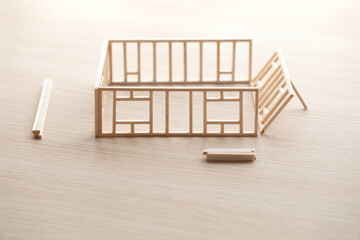 Building a house or a home. Frame work of a house with walls being erected.