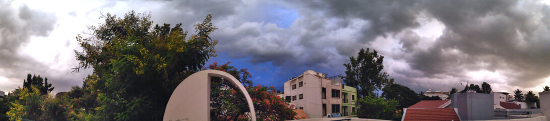 Monsoon clouds over houses in Bangalore, India.