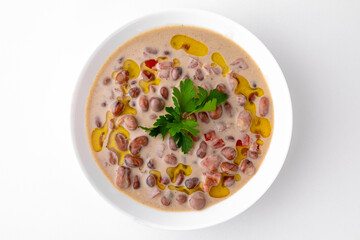 Boiled Beans with Sauce. A dish for delivery, or an online store. Isolated on a white background.