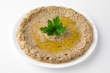 Eggplant caviar. A dish for delivery, or an online store. Isolated on a white background.