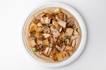 Hummus with chicken. A dish of crushed chickpeas for delivery, or  online store. Isolated on a white background.