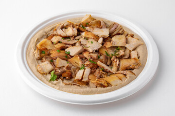Hummus with chicken. A dish of crushed chickpeas for delivery, or  online store. Isolated on a white background.