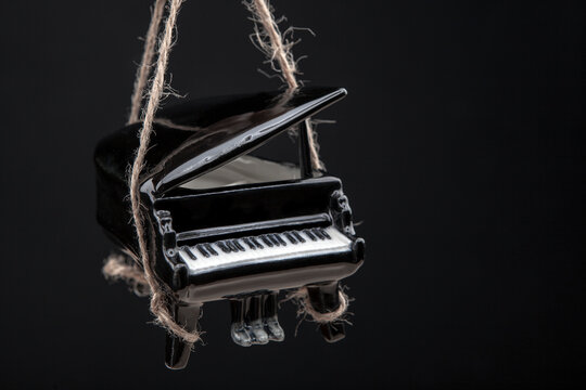 image of black piano rope dark background 